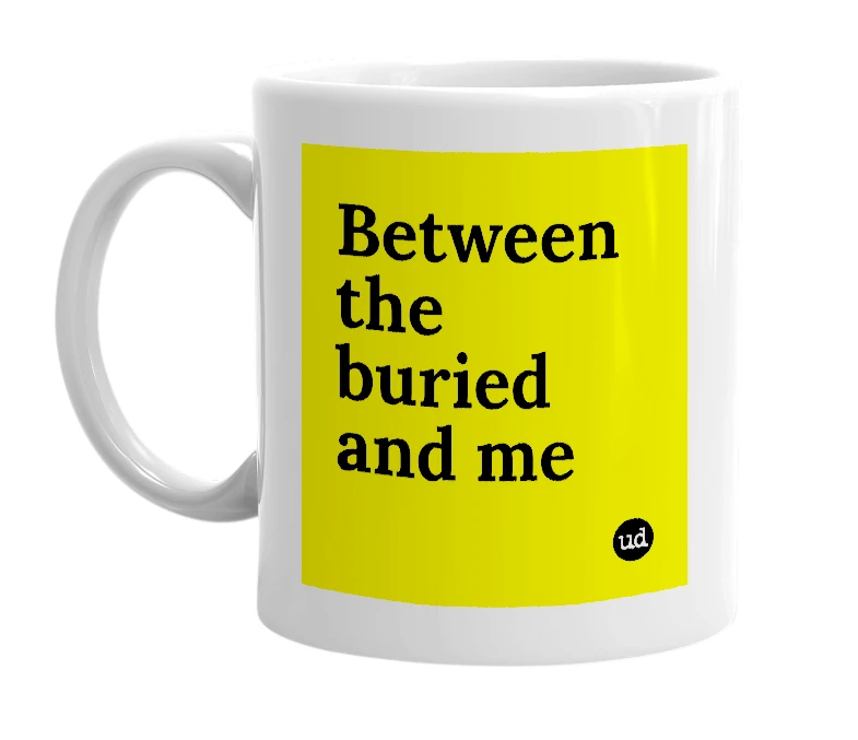 White mug with 'Between the buried and me' in bold black letters