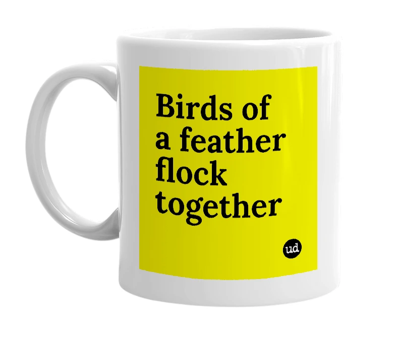 White mug with 'Birds of a feather flock together' in bold black letters