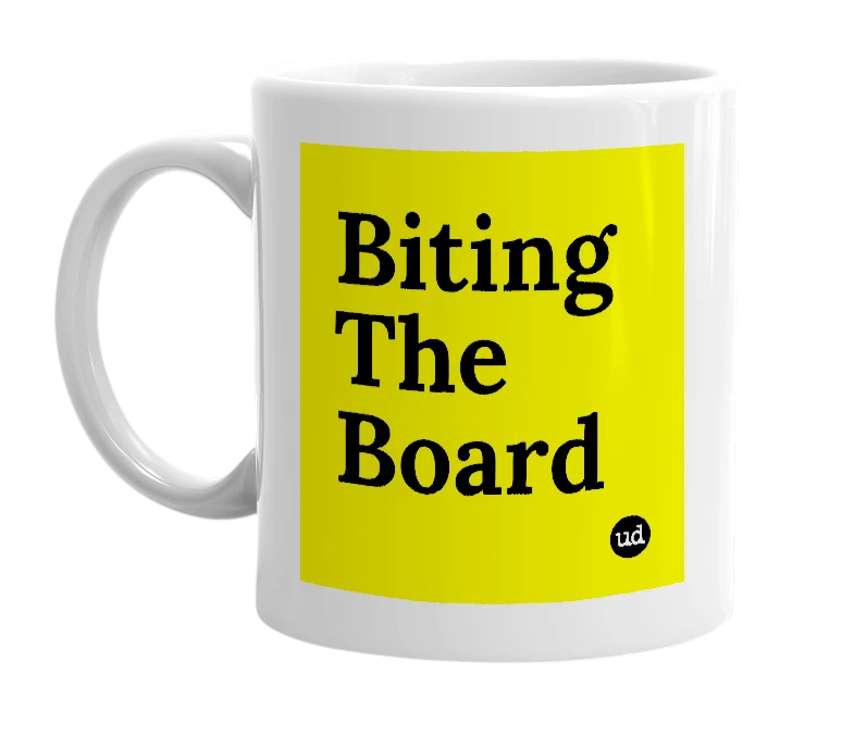 White mug with 'Biting The Board' in bold black letters