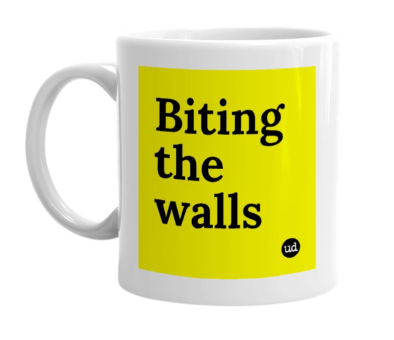 White mug with 'Biting the walls' in bold black letters