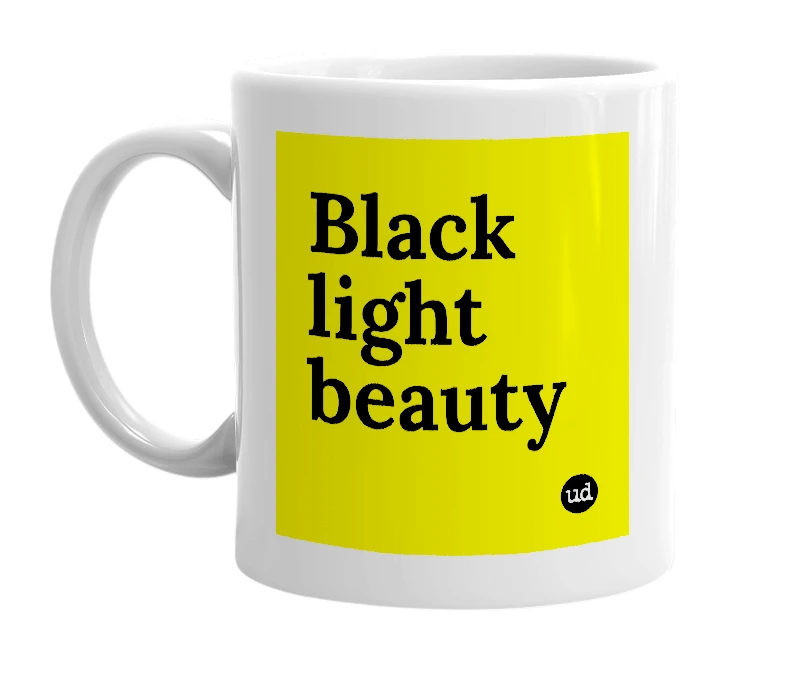 White mug with 'Black light beauty' in bold black letters