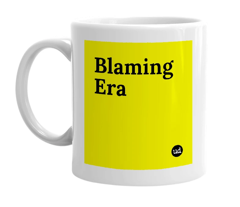 White mug with 'Blaming Era' in bold black letters