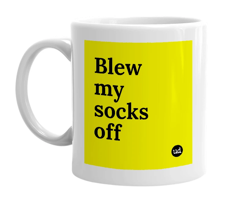 White mug with 'Blew my socks off' in bold black letters