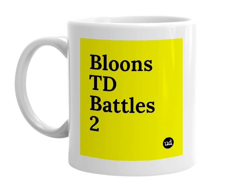 White mug with 'Bloons TD Battles 2' in bold black letters