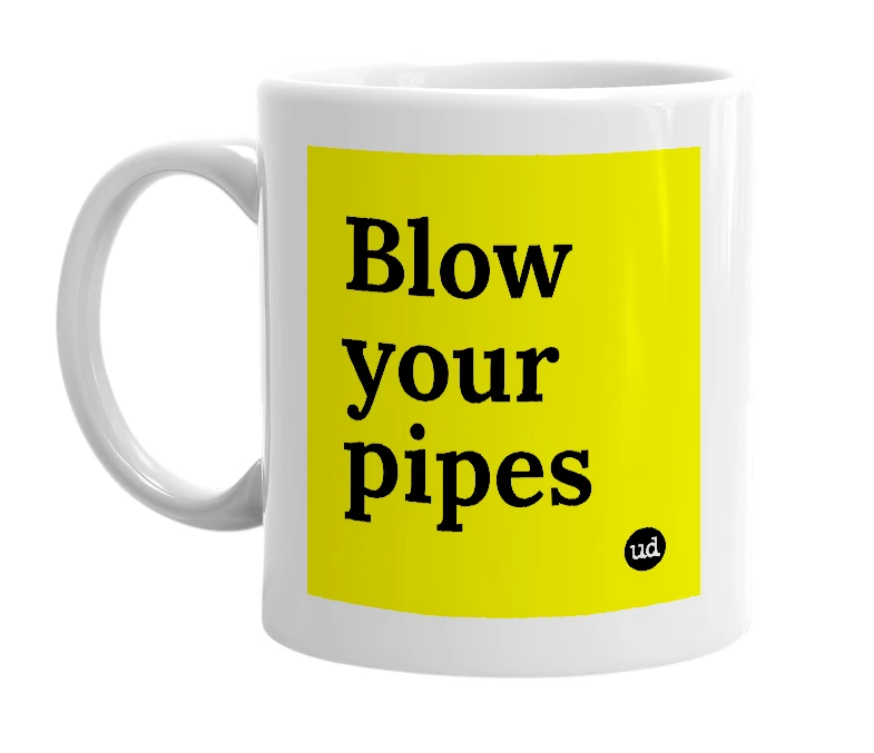 White mug with 'Blow your pipes' in bold black letters