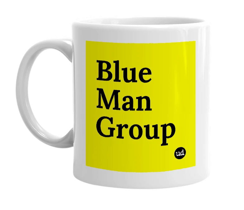 White mug with 'Blue Man Group' in bold black letters