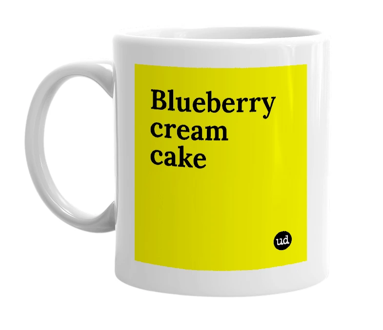 White mug with 'Blueberry cream cake' in bold black letters