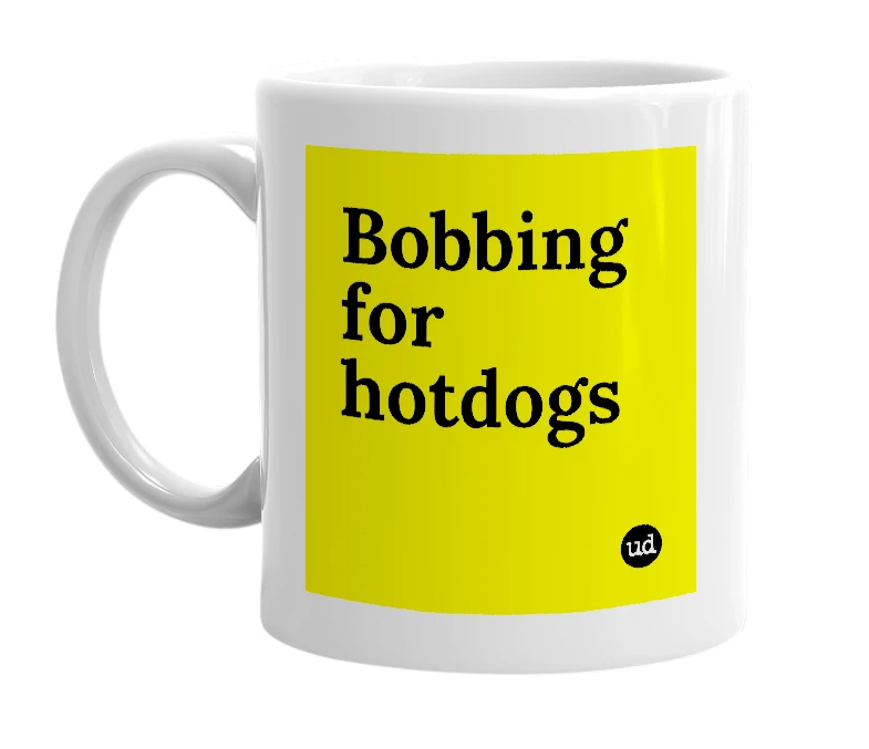 White mug with 'Bobbing for hotdogs' in bold black letters