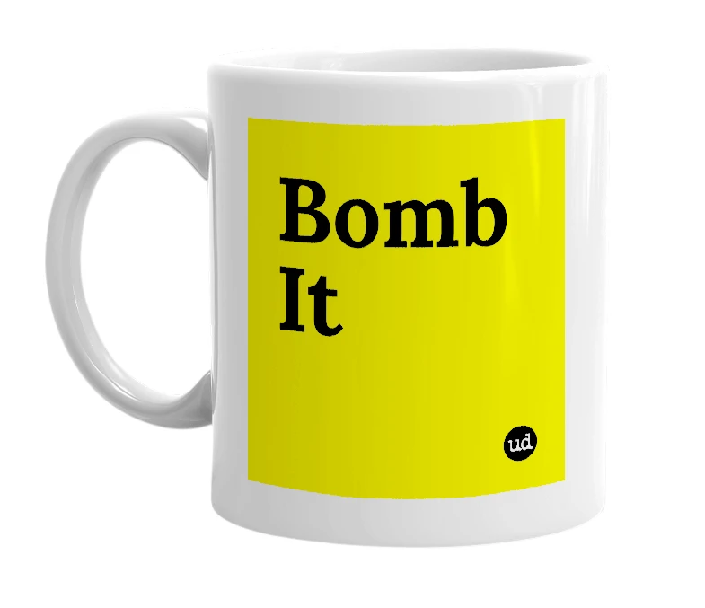 White mug with 'Bomb It' in bold black letters