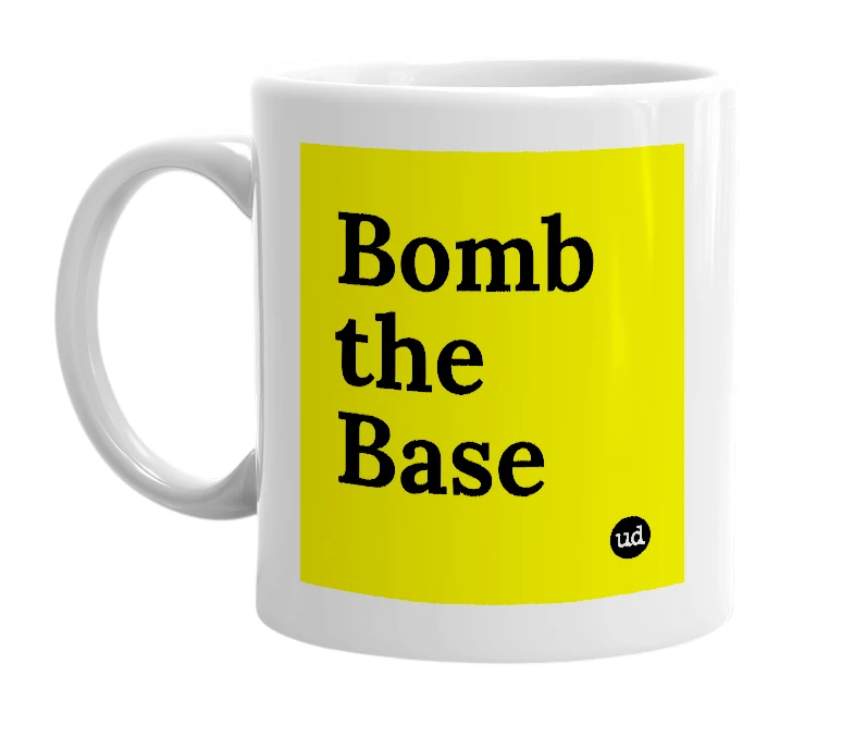 White mug with 'Bomb the Base' in bold black letters