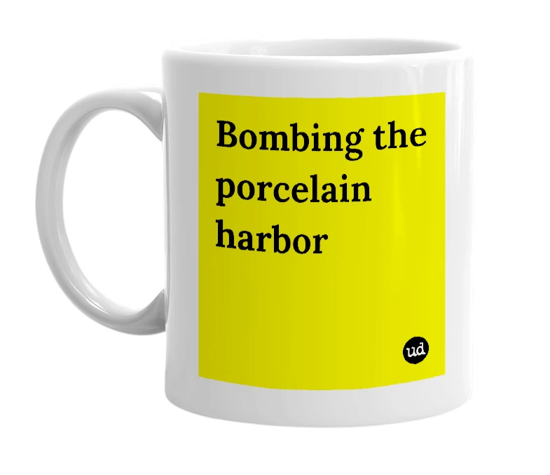 White mug with 'Bombing the porcelain harbor' in bold black letters