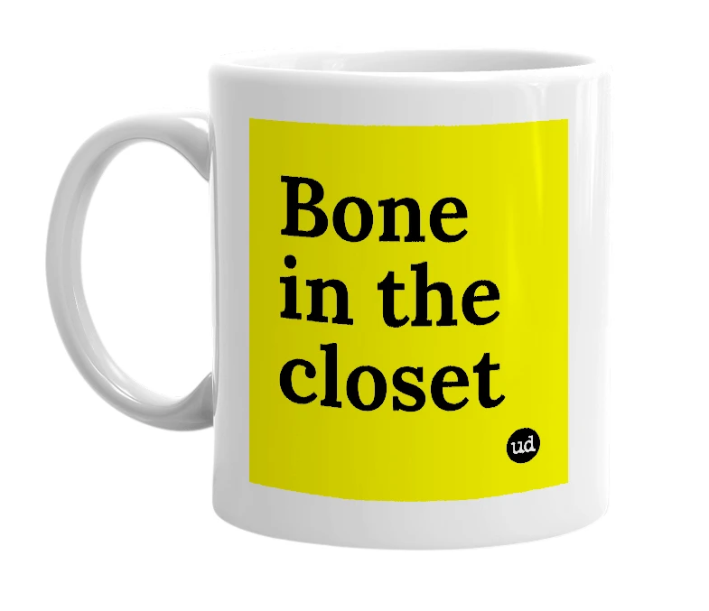 White mug with 'Bone in the closet' in bold black letters