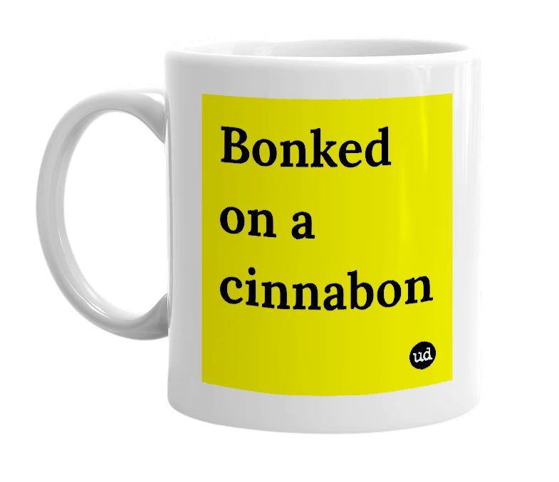 White mug with 'Bonked on a cinnabon' in bold black letters