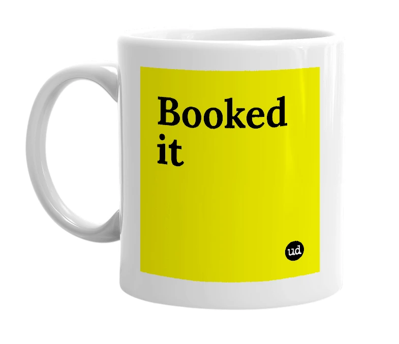 White mug with 'Booked it' in bold black letters