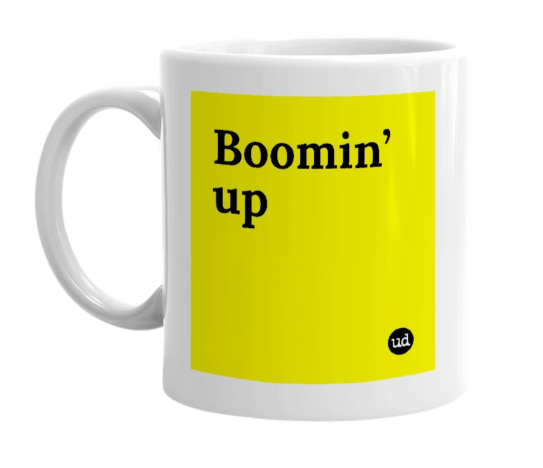 White mug with 'Boomin’ up' in bold black letters