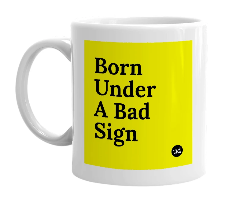 White mug with 'Born Under A Bad Sign' in bold black letters