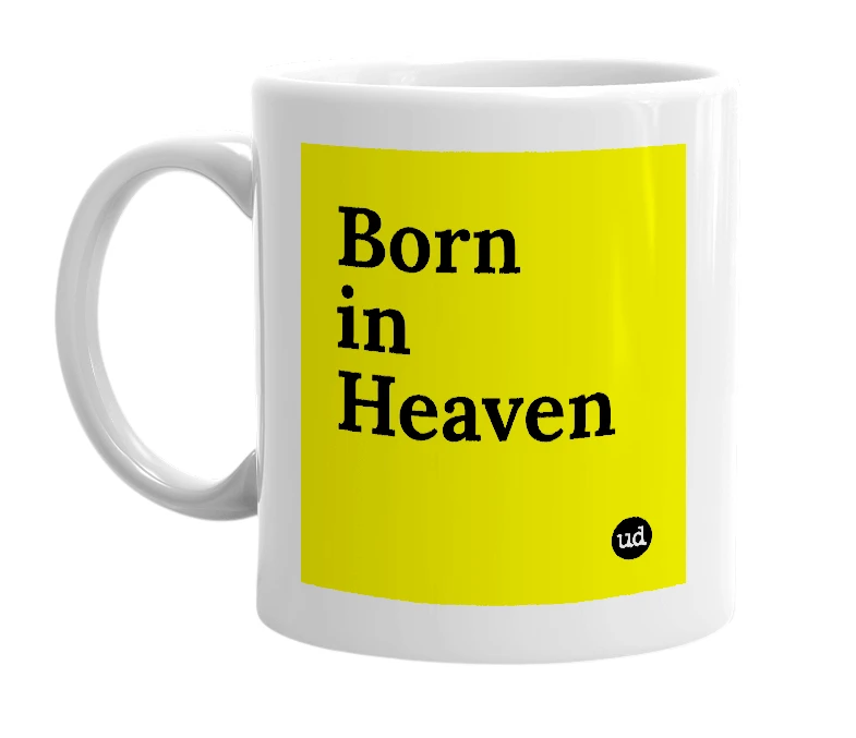 White mug with 'Born in Heaven' in bold black letters
