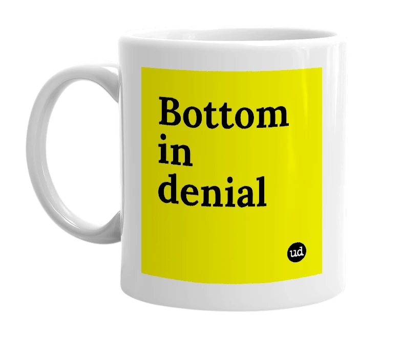 White mug with 'Bottom in denial' in bold black letters