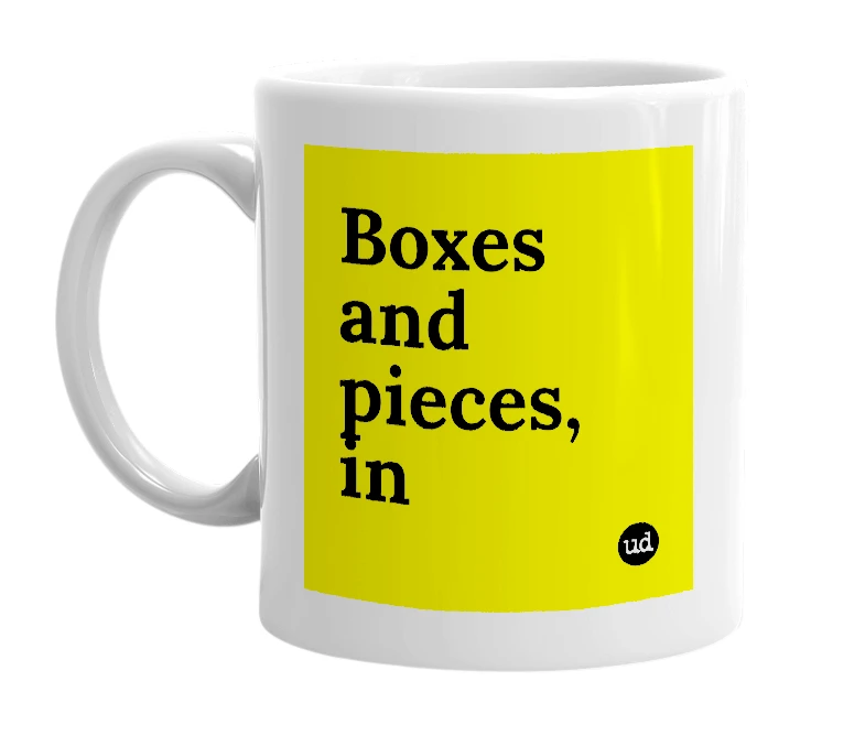 White mug with 'Boxes and pieces, in' in bold black letters