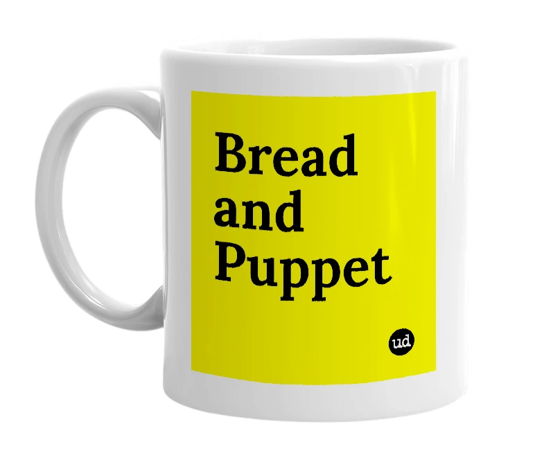 White mug with 'Bread and Puppet' in bold black letters