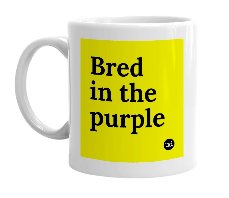 White mug with 'Bred in the purple' in bold black letters