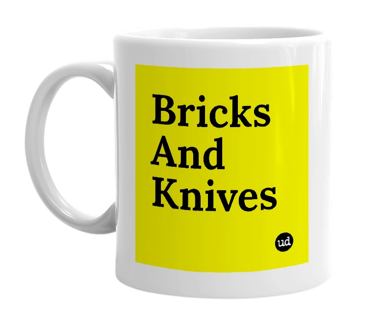 White mug with 'Bricks And Knives' in bold black letters