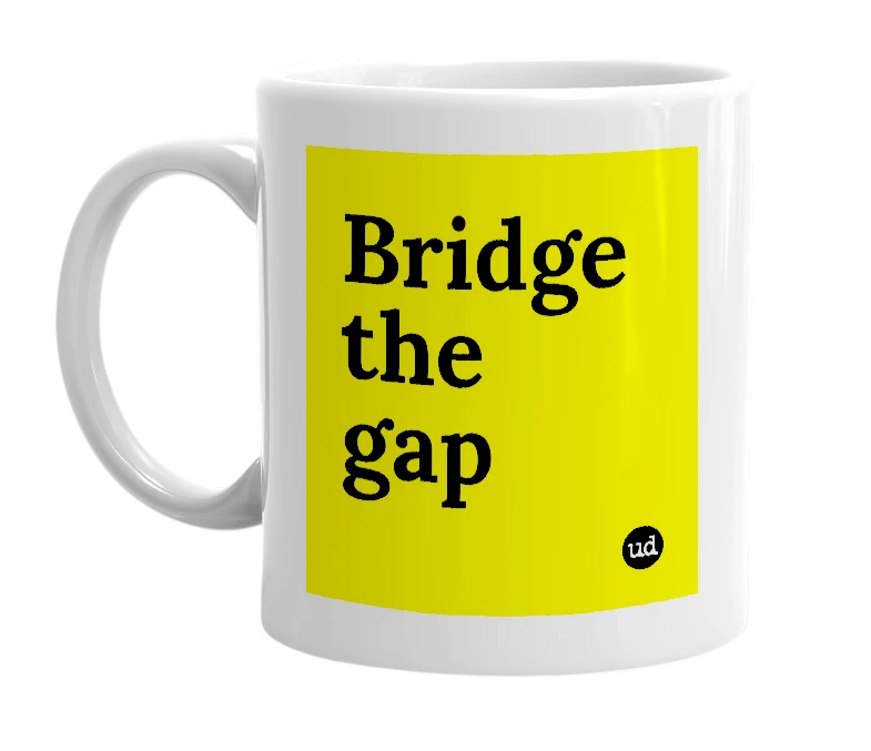 White mug with 'Bridge the gap' in bold black letters