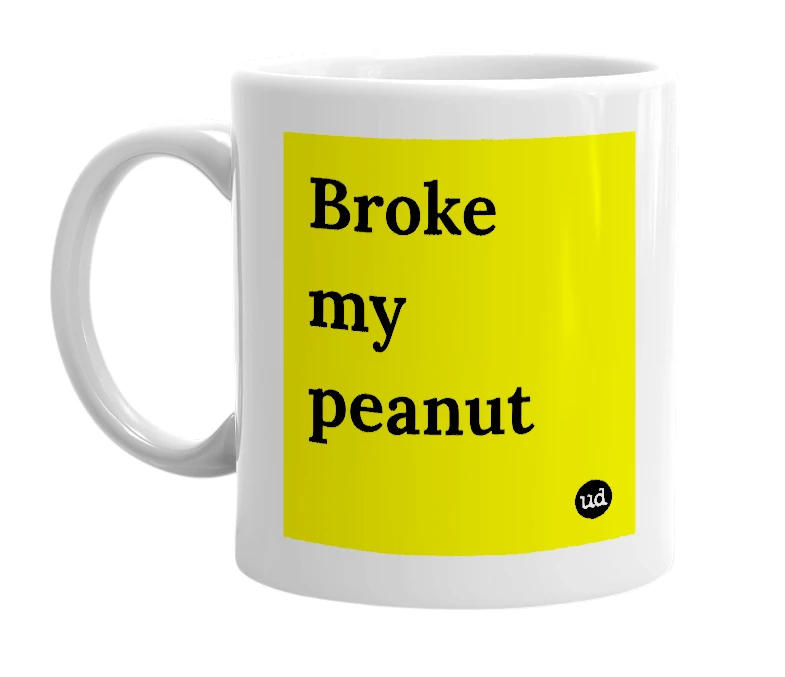 White mug with 'Broke my peanut' in bold black letters