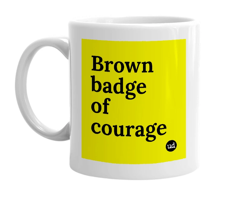 White mug with 'Brown badge of courage' in bold black letters