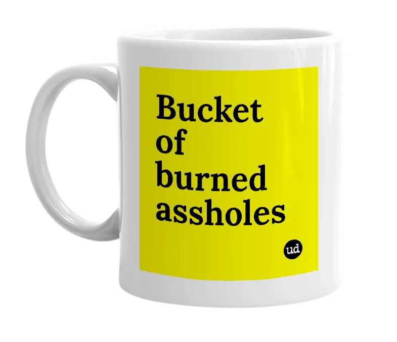 White mug with 'Bucket of burned assholes' in bold black letters