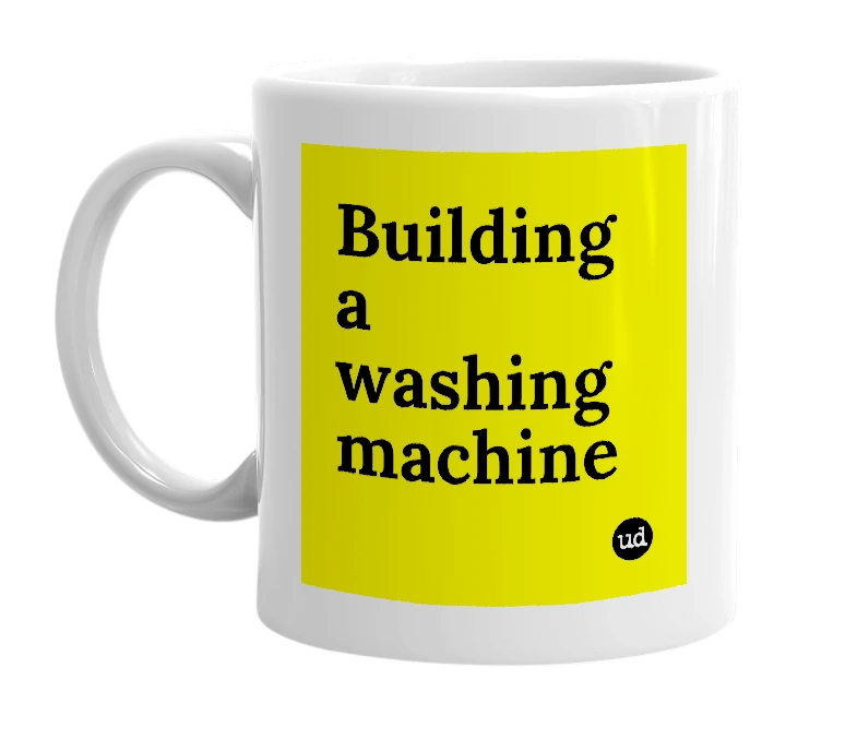 White mug with 'Building a washing machine' in bold black letters