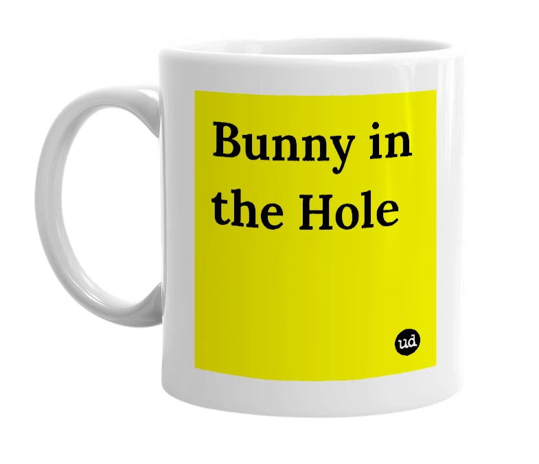 White mug with 'Bunny in the Hole' in bold black letters