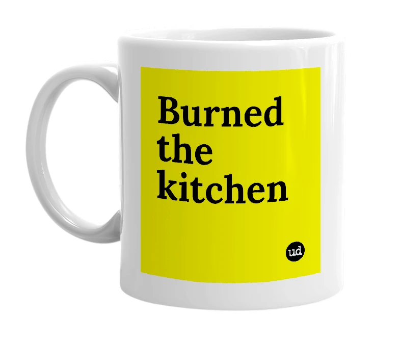 White mug with 'Burned the kitchen' in bold black letters