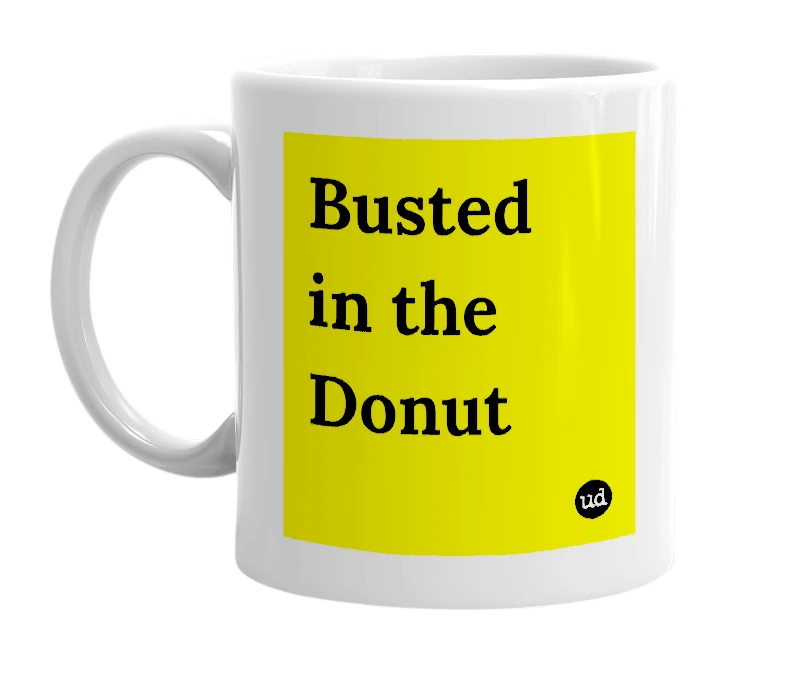 White mug with 'Busted in the Donut' in bold black letters