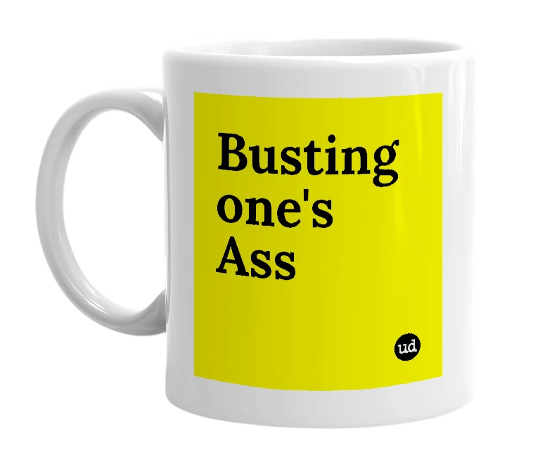 White mug with 'Busting one's Ass' in bold black letters