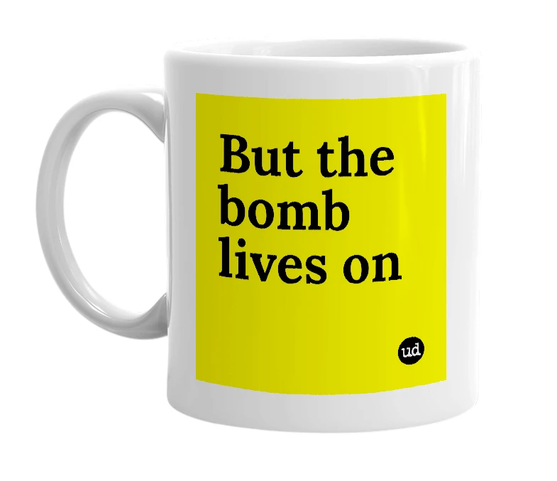 White mug with 'But the bomb lives on' in bold black letters