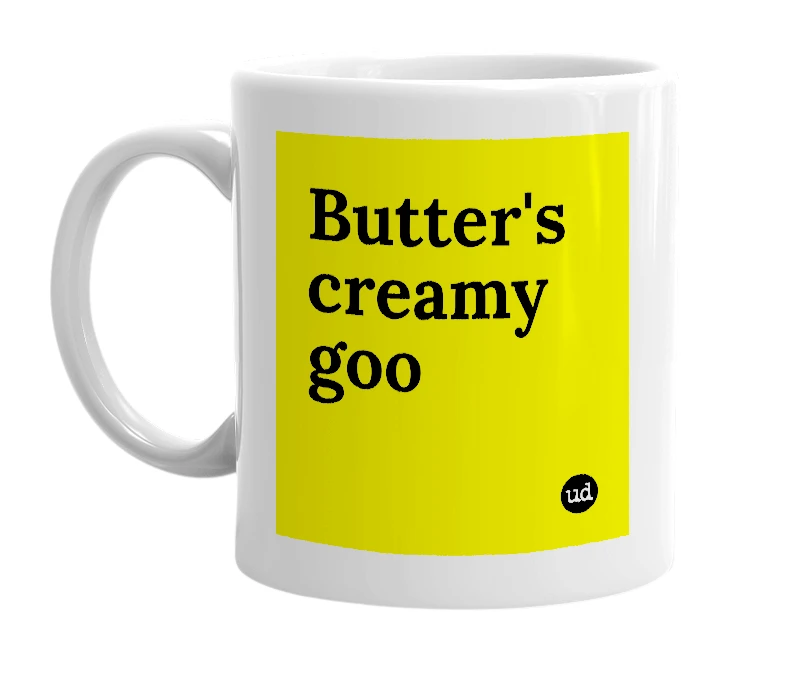 White mug with 'Butter's creamy goo' in bold black letters