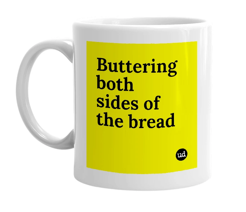 White mug with 'Buttering both sides of the bread' in bold black letters