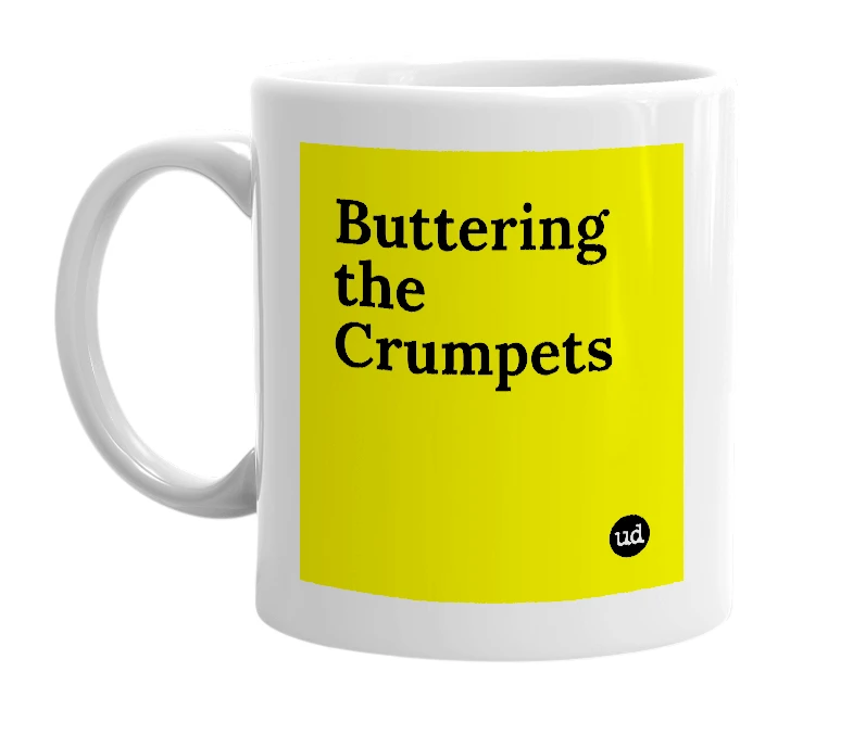 White mug with 'Buttering the Crumpets' in bold black letters