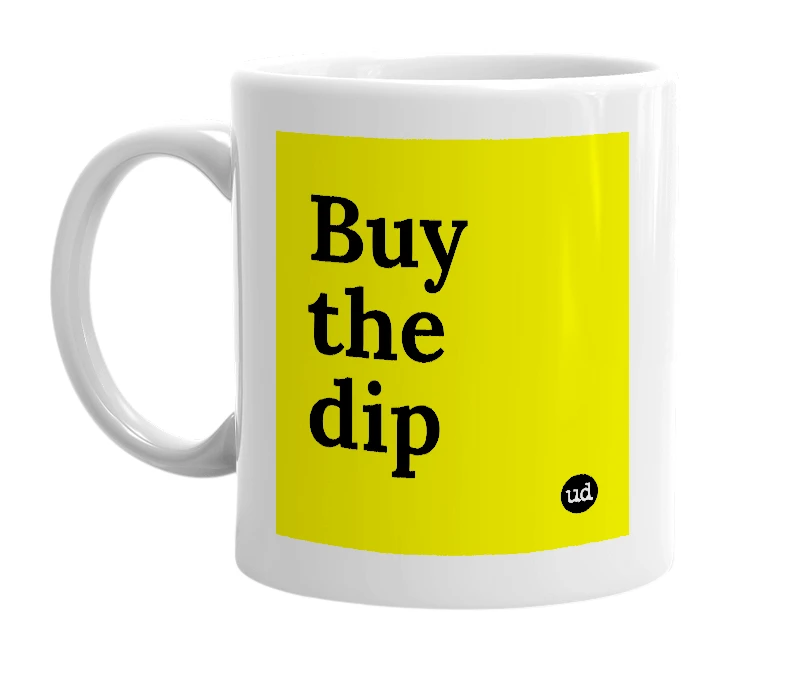 White mug with 'Buy the dip' in bold black letters