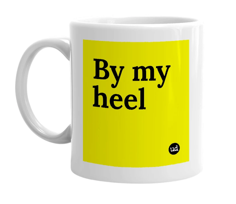 White mug with 'By my heel' in bold black letters