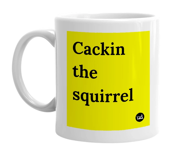 White mug with 'Cackin the squirrel' in bold black letters