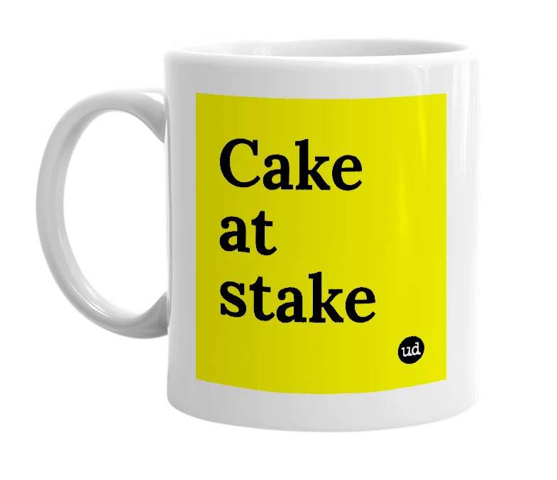 White mug with 'Cake at stake' in bold black letters