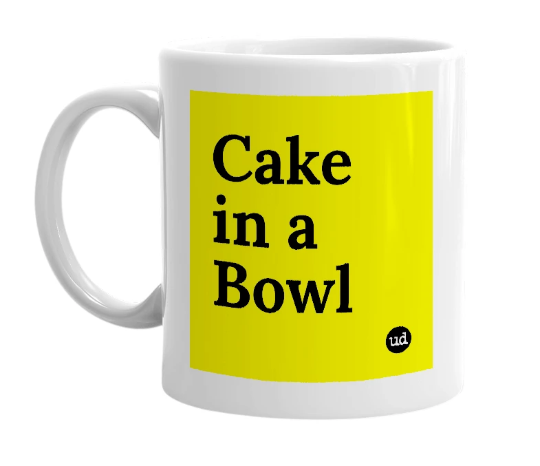 White mug with 'Cake in a Bowl' in bold black letters