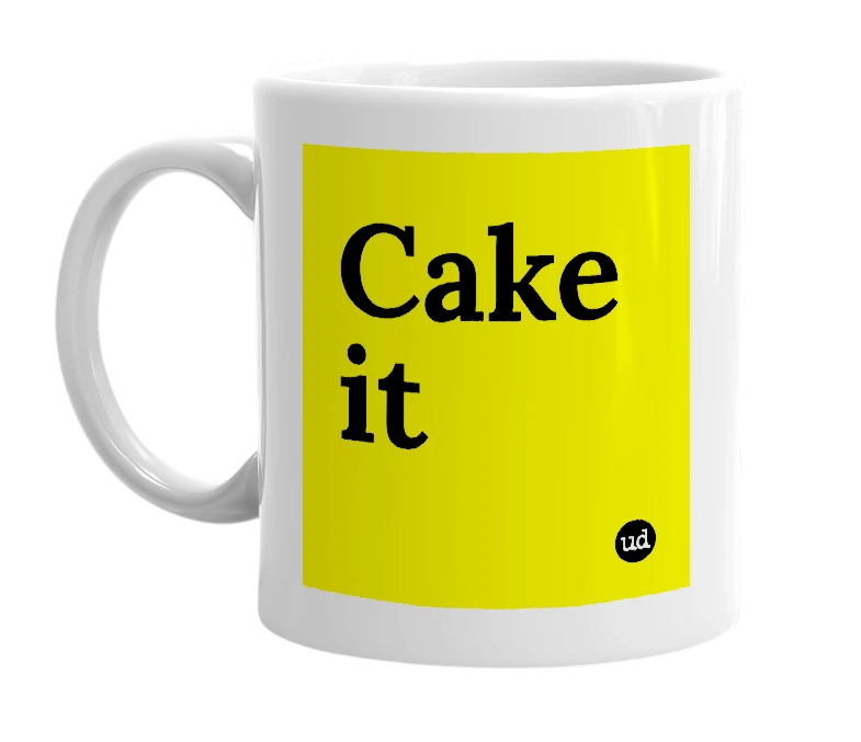 White mug with 'Cake it' in bold black letters