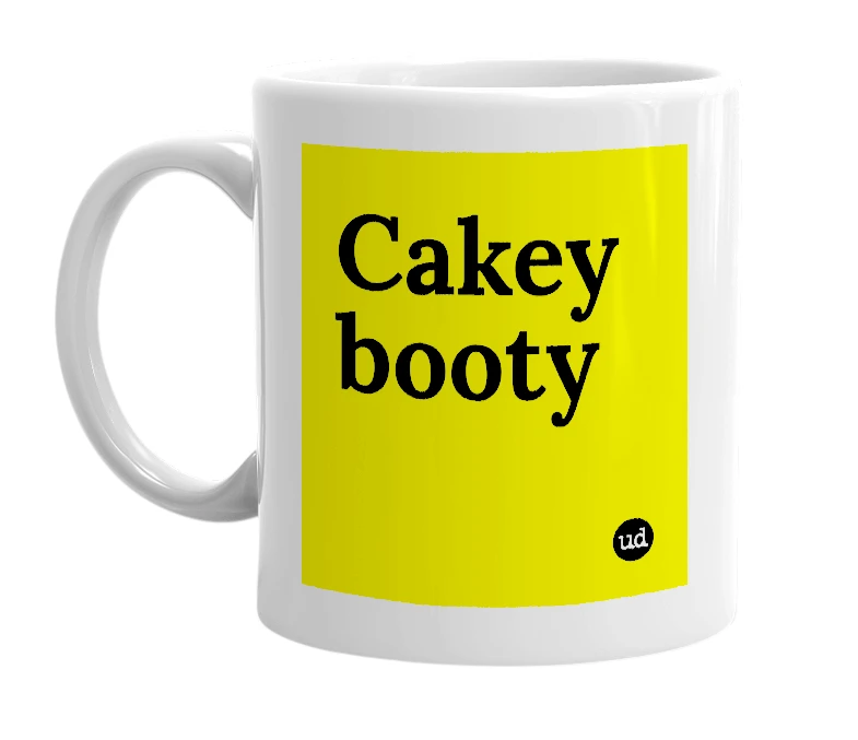 White mug with 'Cakey booty' in bold black letters