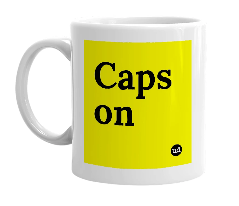 White mug with 'Caps on' in bold black letters