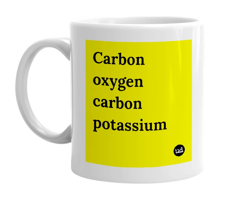 White mug with 'Carbon oxygen carbon potassium' in bold black letters