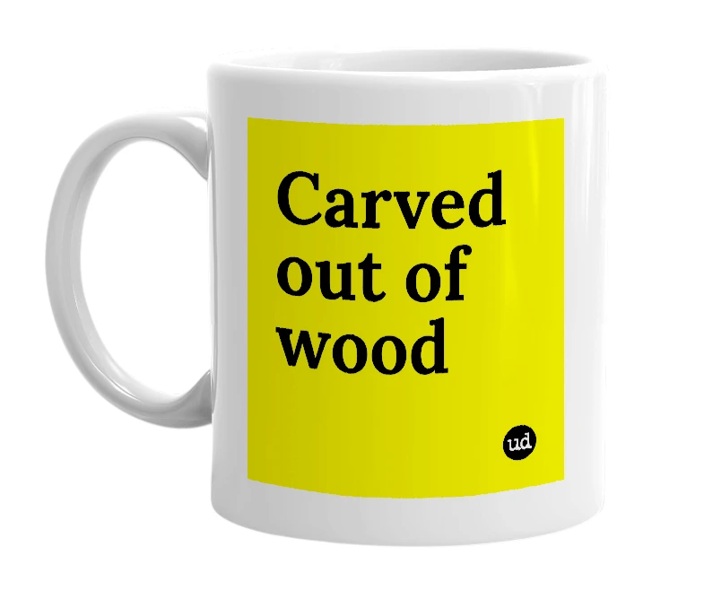 White mug with 'Carved out of wood' in bold black letters