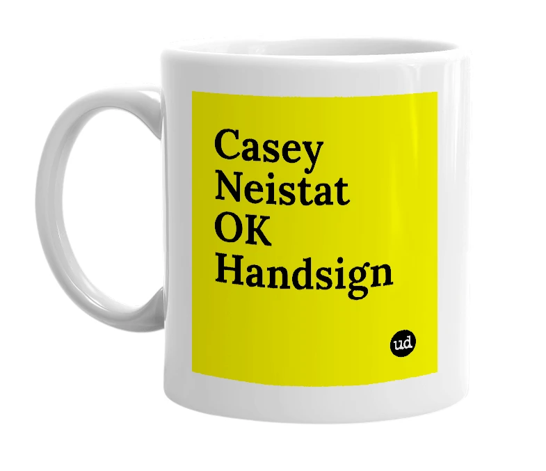 White mug with 'Casey Neistat OK Handsign' in bold black letters